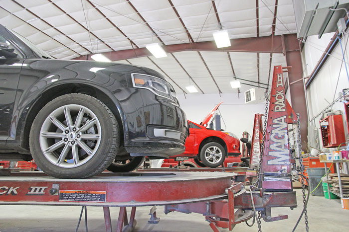 Vehicle mounted on a Magna Rack frame machine at 5th & Oak Autobody